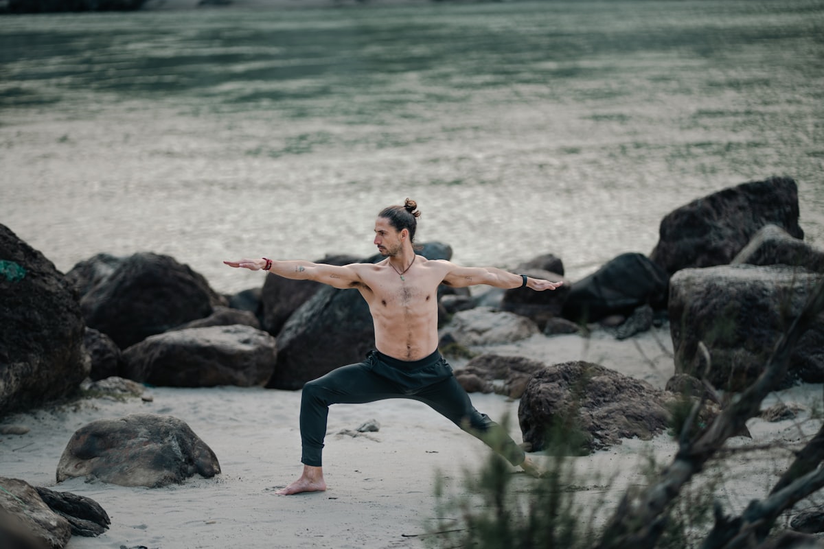 Man performing warrior yoga pose